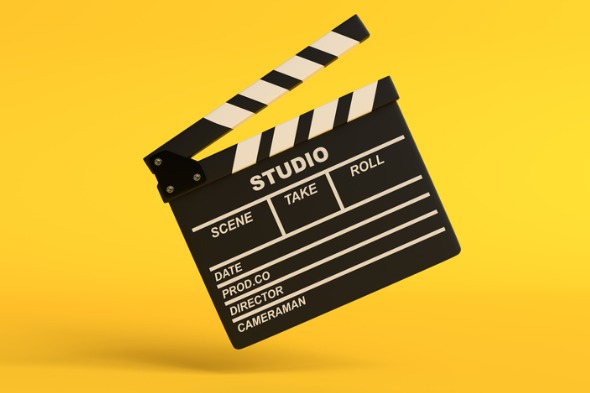 flying-lapperboard-isolated-on-bright-yellow-background-in-pastel-picture-id1202770156