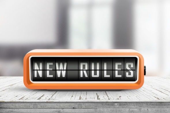 new-rules-alarm-message-on-a-wooden-desk-picture-id1136852280